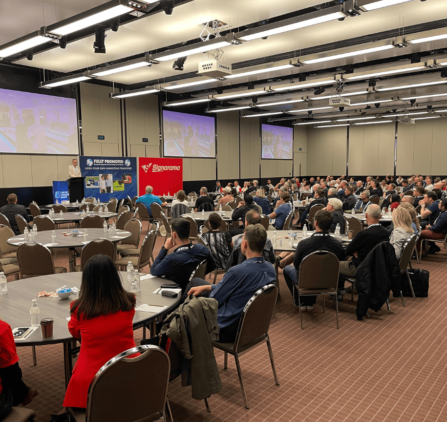 Innovative franchise conference hosted by United Franchise Group showcasing franchise opportunities, business growth strategies, and networking with industry leaders in a large, professional event setting.