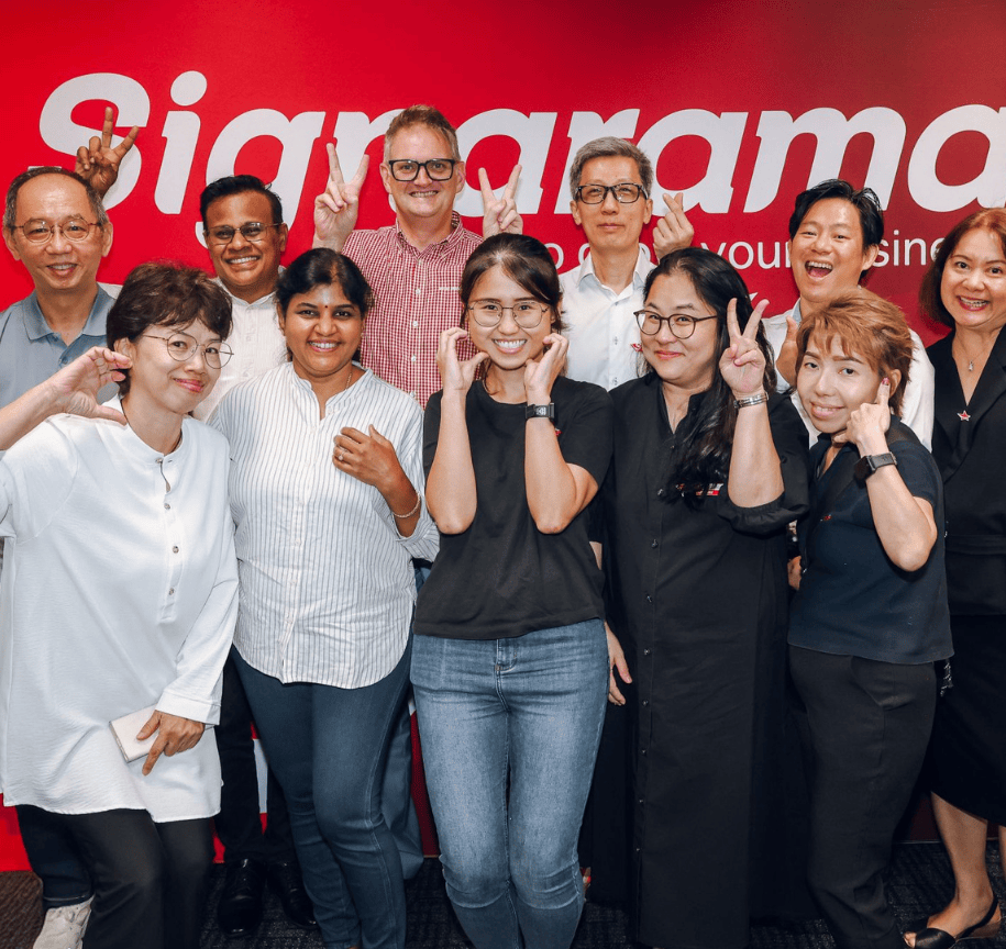 1. Group of diverse entrepreneurs celebrating success at United Franchise Group event, promoting franchising opportunities and business growth.