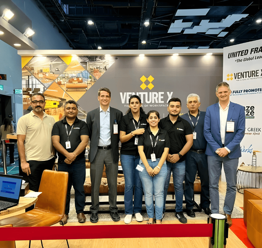 Flexible franchise business team representatives showcasing Venture X at United Franchise Group event in Australia.